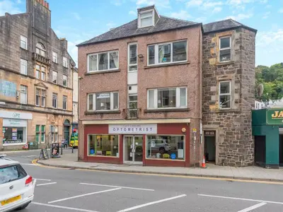 a building on the corner of a street at Bay View in Oban