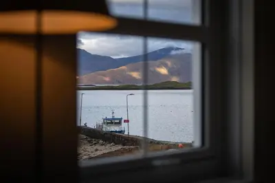 a view of a lake from a window at The Pierhouse Hotel in Port Appin