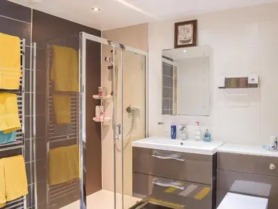 a bathroom with a shower and a sink at Wallace View in Stirling