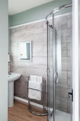 a bathroom with a shower and a sink at Carvetii - Meg's Studio - 1st Floor, Dunfermline City Centre in Dunfermline