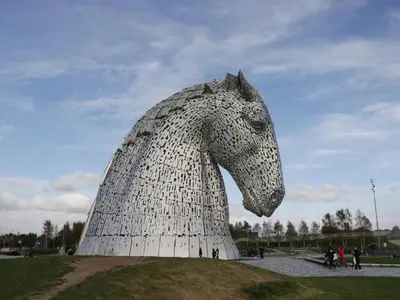 a statue of a horse on top of a field at Hazel in Denny