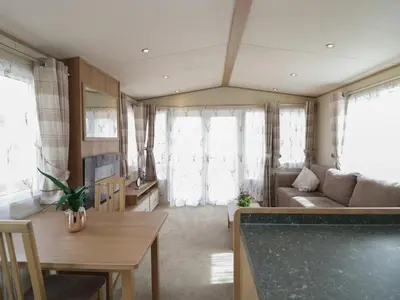 a living room with a couch and a table at Hazel in Denny