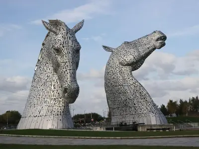 two large statues of horses standing next to each other at Yew in Denny