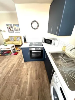 a kitchen with a sink and a stove top oven at Prestwick KingB PetsOk FreeP Wifi Tv in Prestwick