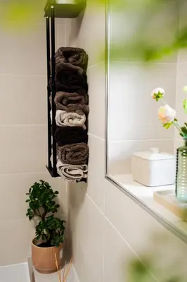 a towel rack in a bathroom with towels at 24 Kingsford Court in Newton Mearns