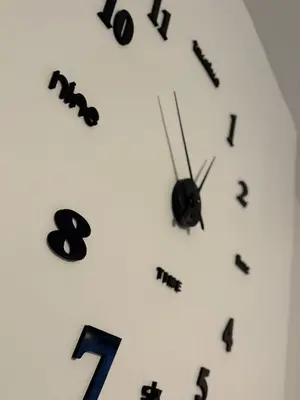 a white clock with black numbers on it at 2 Bed Flat - Street Parking in Glasgow