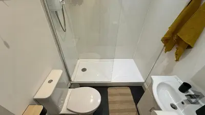 a small bathroom with a toilet and a sink at Flat for 6 guests near Glasgow, Loch Lomond in Dumbarton