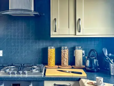 a kitchen counter with two containers of food at Brand New Scotland home 3rooms near Glasgow in Clydebank