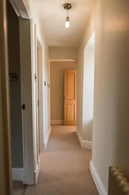 an empty hallway with a door and a hallwayngth at Rosebank Cottage - Hot Tub & Log Stove in Alexandria