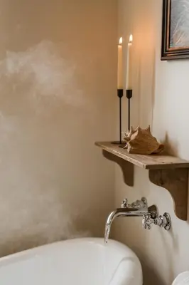 a bathroom with a bath tub and candles on the wall at Rosebank Cottage - Hot Tub & Log Stove in Alexandria