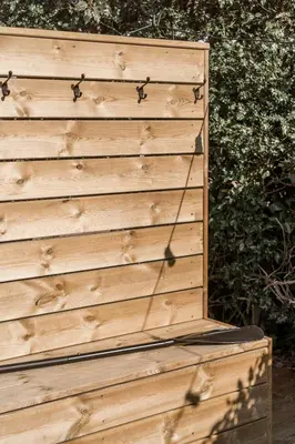 a wooden privacy fence with spiders on it at Rosebank Cottage - Hot Tub & Log Stove in Alexandria
