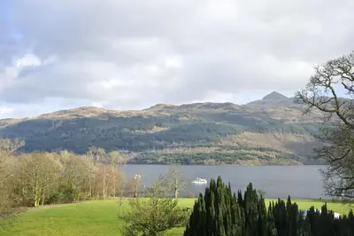 a view of a lake with mountains in the background at The Tarbet Hotel in Tarbet