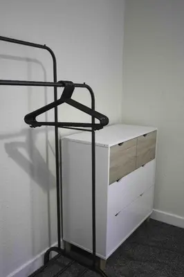 a room with a white shelf and a white cabinet at Cochran House in Bathgate