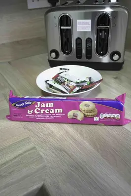 a box of cookies on a counter next to a toaster at Pentland House in Bathgate