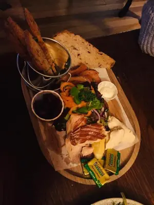 a plate of food on a table with bread and food at The Cross Keys in Kippen in Kippen
