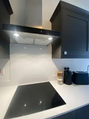 a kitchen with a black sink and a microwave at 4 Smithhills Central 2 bed sleeps 4 in Paisley