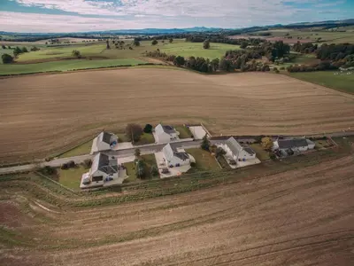 an aerial view of a large house in the middle of a field at Langside - Uk47885 in Keilour