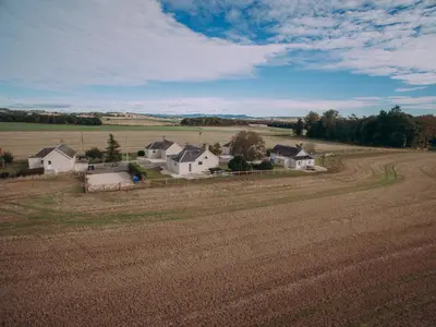a farm with a field and houses in the distance at Langside - Uk47885 in Keilour