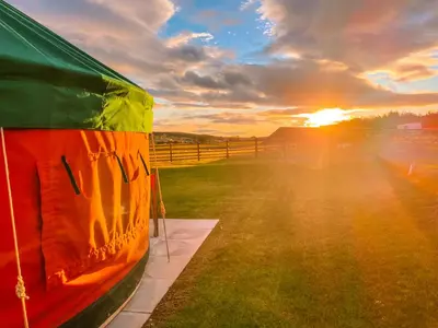 a view of the sunset from the inside of a tent at Timothy Yurt - Uk47889 in Keilour