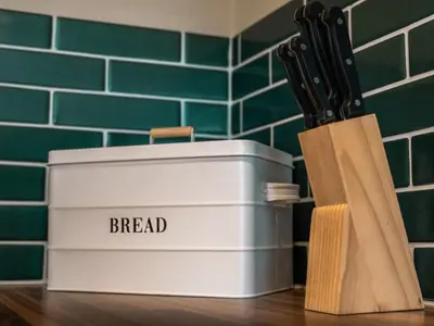 a lunch box on a table next to a knife block at Dovecote - Uk47887 in Keilour