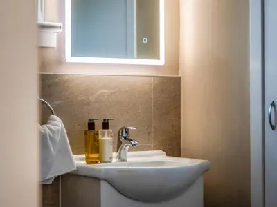 a bathroom with a sink and a mirror at Dovecote - Uk47887 in Keilour