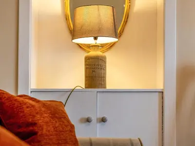 a lamp on top of a cabinet next to a bed at Ninetrees - Uk47883 in Keilour