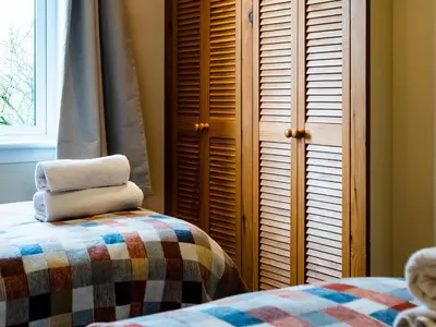 a bedroom with a bed and a window and shutters at Ninetrees - Uk47883 in Keilour