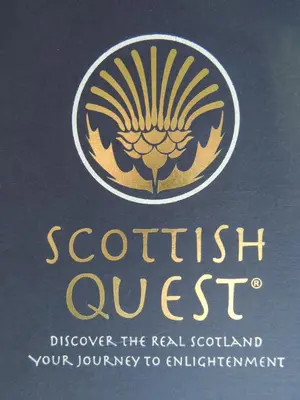 a book with the scottish quest logo on it at Crieff Armoury in Crieff