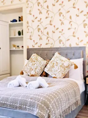 a bedroom with a bed with towels on it at No15 Castle View in Edinburgh
