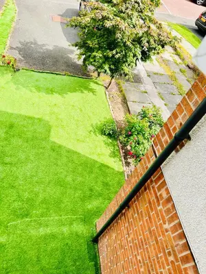 an aerial view of a yard with green grass at Glasgow Central guest house free parking in Govan