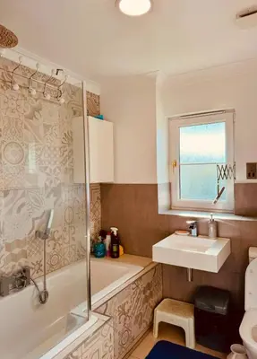 a bathroom with a tub and a sink and a shower at Glasgow Central guest house free parking in Govan