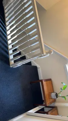 a spiral staircase with a plant in a vase at Glasgow Central guest house free parking in Govan