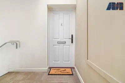a welcome mat in front of a white door at Elegant 2Bed Sleeps 4 With Parking in Paisley