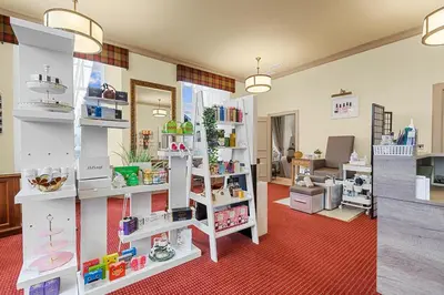 a room with white shelves in a store at Ugadale Cottages in Machrihanish