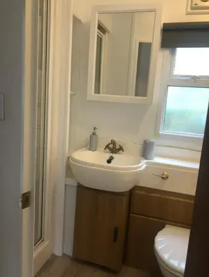 a bathroom with a sink and a toilet at The Art Studio Arran in Isle of Arran