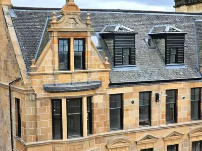 a brick building with windows and a roof at 3 Smithhills Paisley central spacious sleeps 4 in Paisley