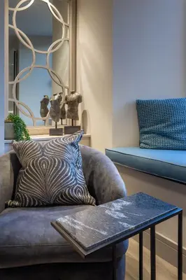 a living room with a couch and a table at Arran Shores Luxury Shorefront Apartment 2 in Lamlash
