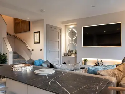 a kitchen and living room with a large counter top at Arran Shores Luxury Shorefront Apartment 2 in Lamlash