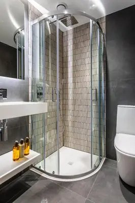 a shower with a glass door in a bathroom at Arran Shores Luxury Shorefront Apartment 5 in Lamlash