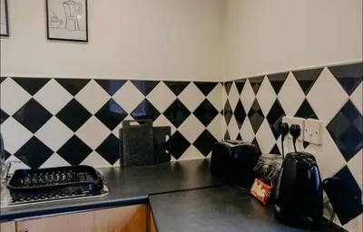 a kitchen with a counter top with a keyboard at Glasgow - 1 Bedroom Apartment in Glasgow