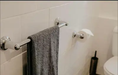 a towel hanging on a towel rack in a bathroom at Glasgow - 1 Bedroom Apartment in Glasgow