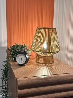 a table with a lamp and a clock on it at Stylish 2 bed City Retreat in Glasgow