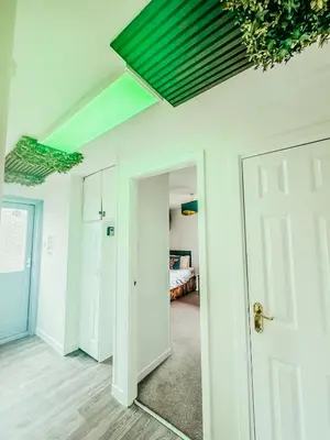 a room with a white door and a bedroom at Wild Jungle Retreat in Kirn