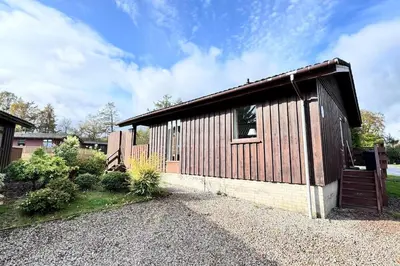 a small house with a building at Wild Jungle Retreat in Kirn