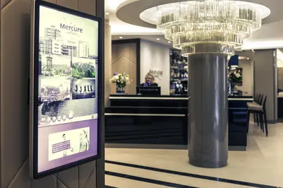a chandelier and a sign in a store at Mercure Edinburgh Haymarket in Edinburgh