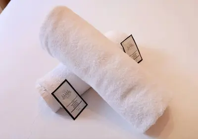 two rolls of toilet paper sitting on a table at Grassmarket Apartment with Amazing Castle View in Edinburgh