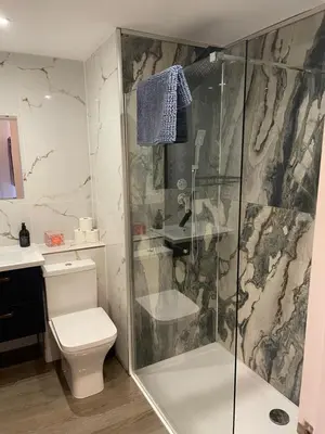 a bathroom with a shower and a toilet and a sink at Harbour bliss in Ardrossan