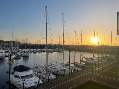 a group of boats docked in a marina at sunset at Harbour bliss in Ardrossan