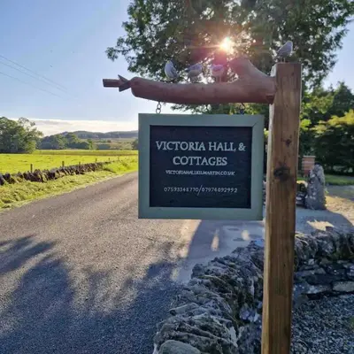 a sign on a pole next to a road at Wagtail Cottage in Kilmartin