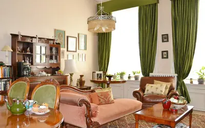 a living room with a couch and a table at Maybank Guest House in Helensburgh